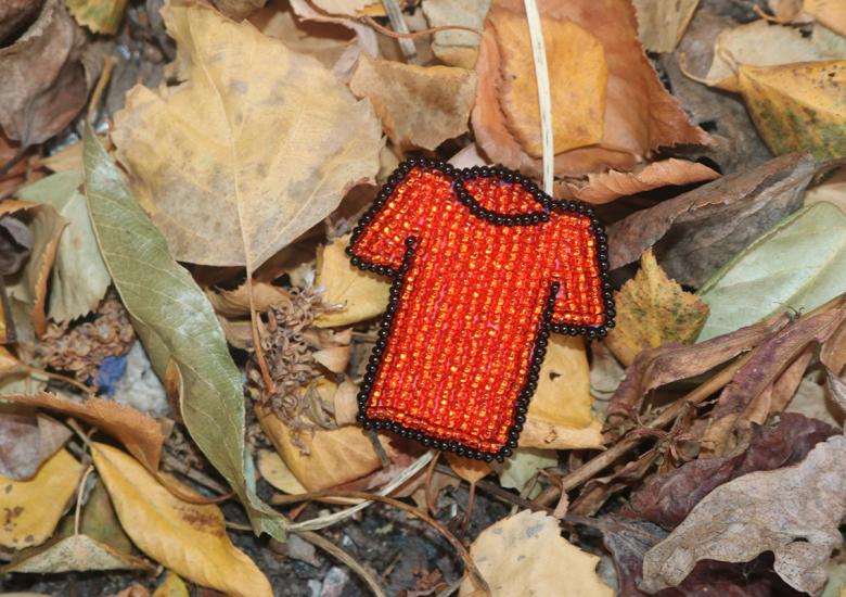 Orange Shirt Pin design courtesy of Tribal Roots. Photo credit: Simon Whitehouse